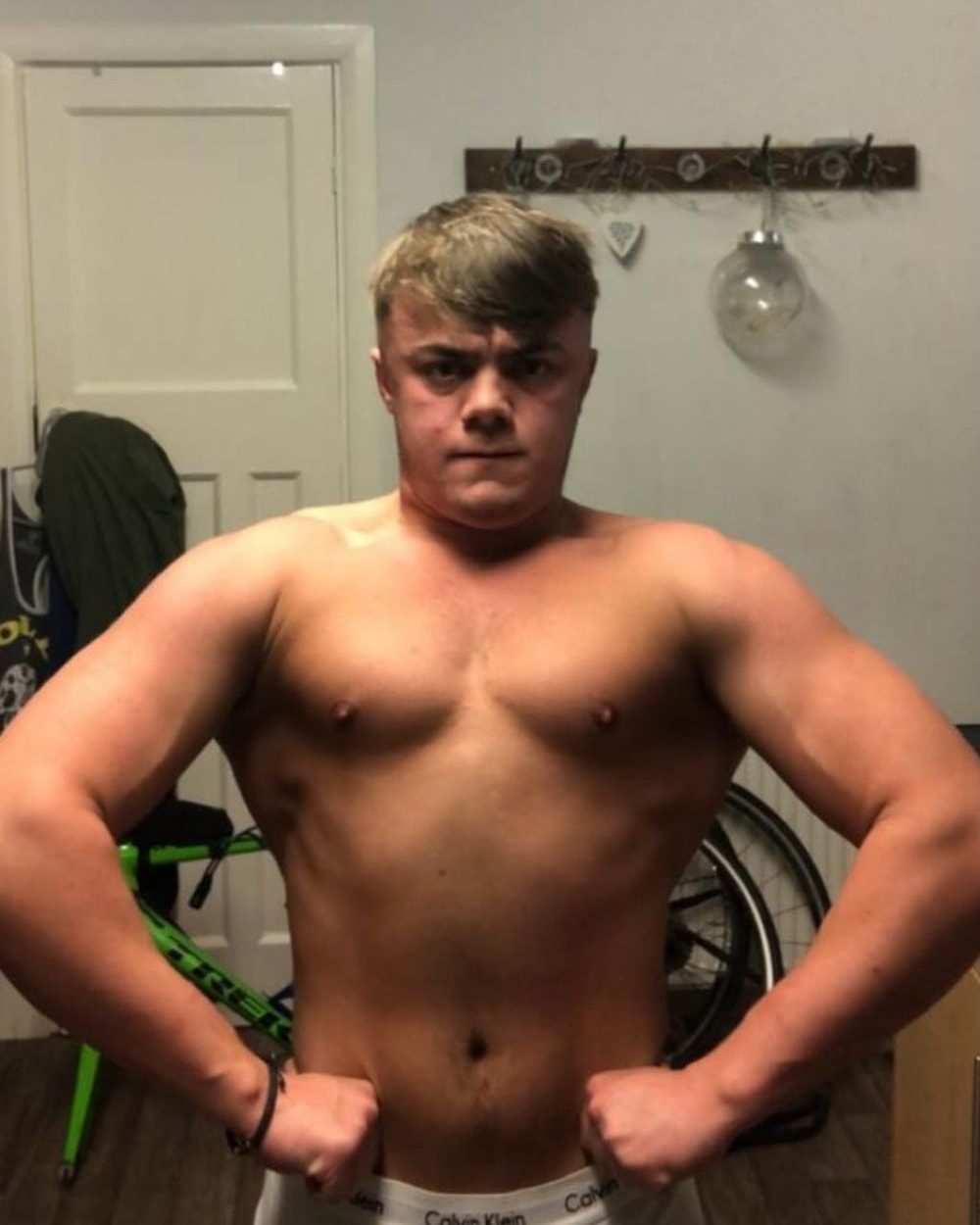 Client 2 before coaching: front lat spread, carrying fat across the chest and midsection